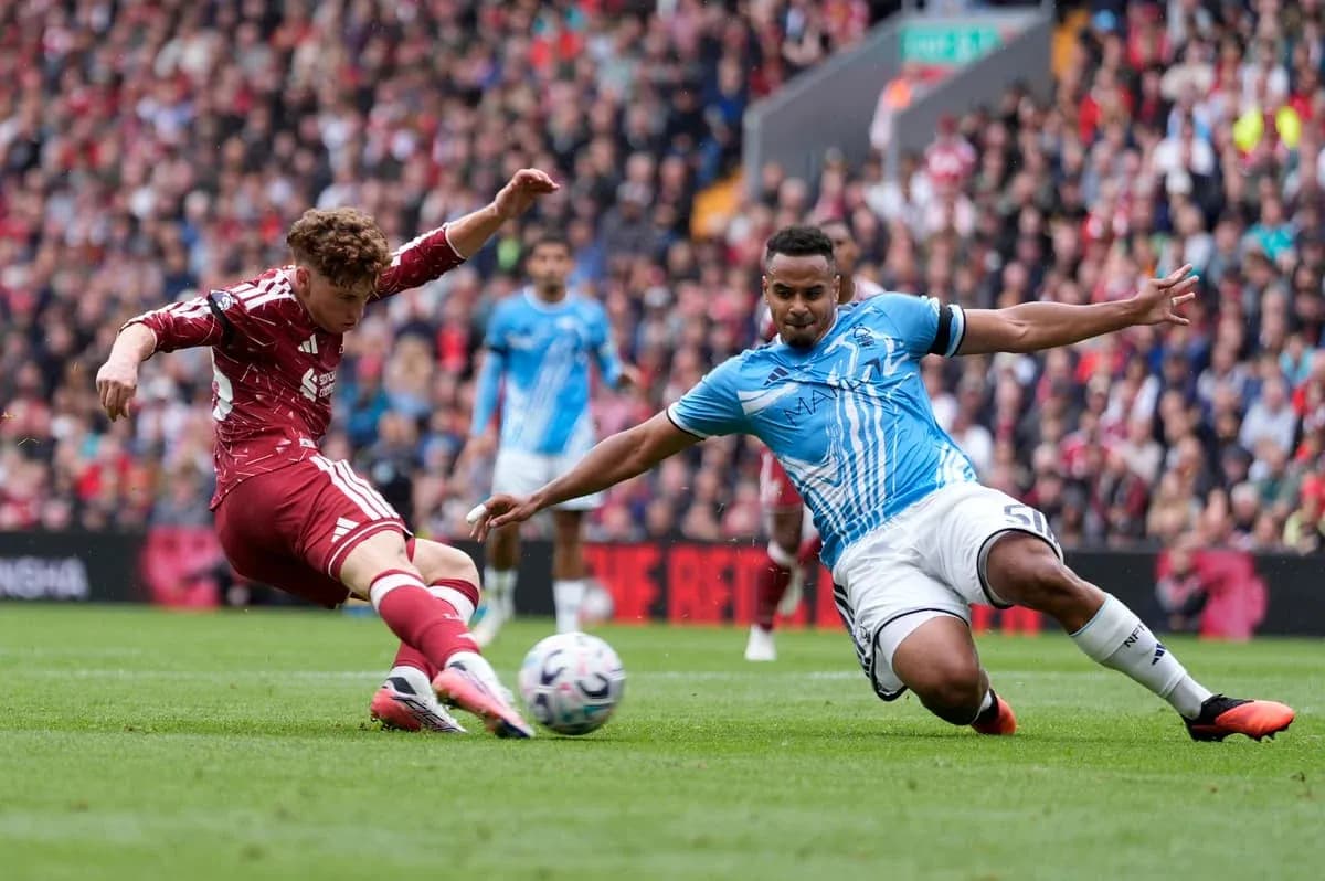 Player sliding to tackle another during match Player sliding to tackle another during match