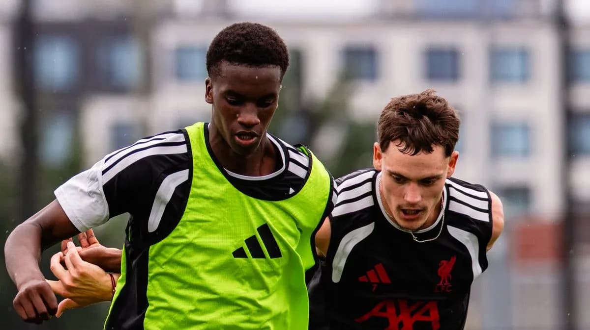 Two players competing for the ball during training Two players competing for the ball during training