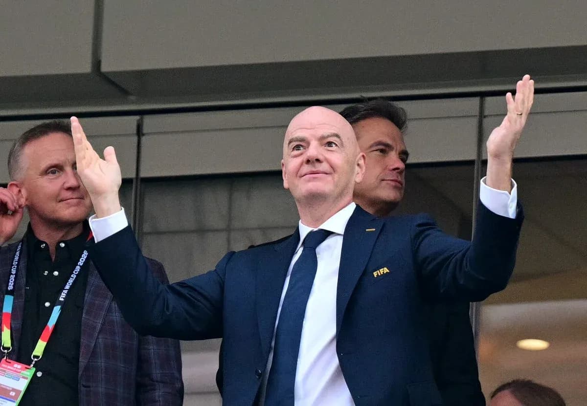 FIFA president gesturing from VIP box during event FIFA president gesturing from VIP box during event