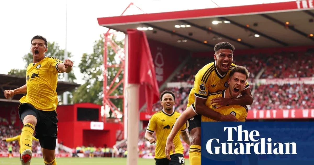 Players celebrating a goal at a football match Players celebrating a goal at a football match