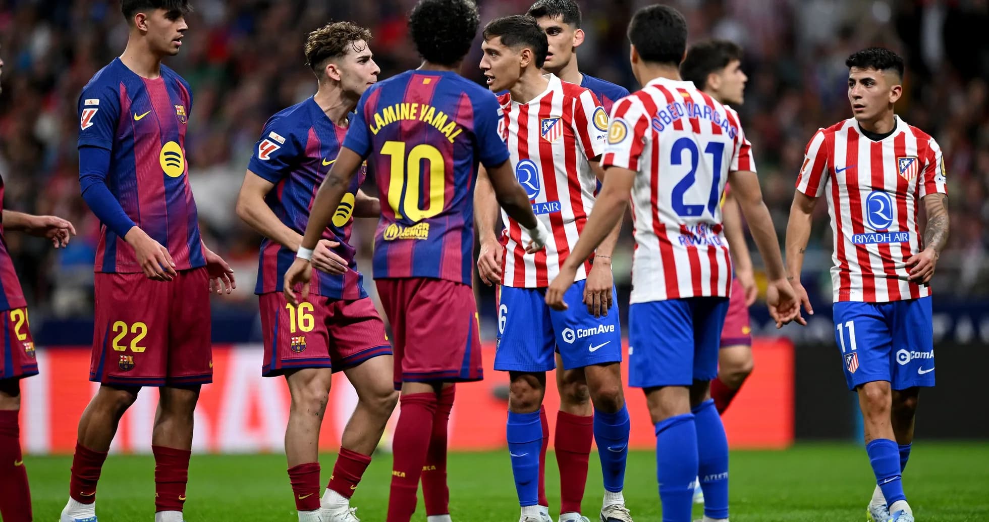 Players from Barcelona and Atletico Madrid discussing during match Players from Barcelona and Atletico Madrid discussing during match