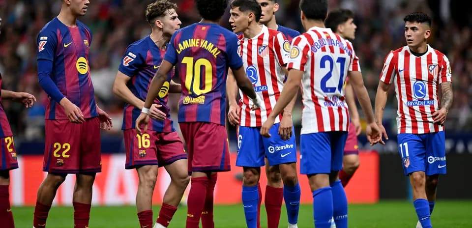 Players from Barcelona and Atletico Madrid discussing during match Players from Barcelona and Atletico Madrid discussing during match