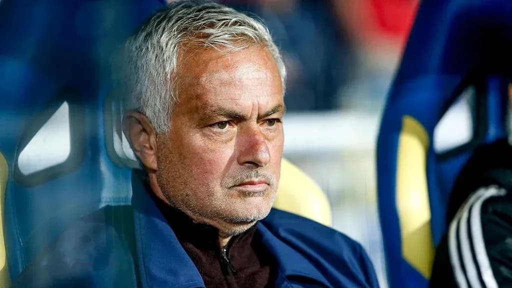Manager sitting on the bench during a match Manager sitting on the bench during a match