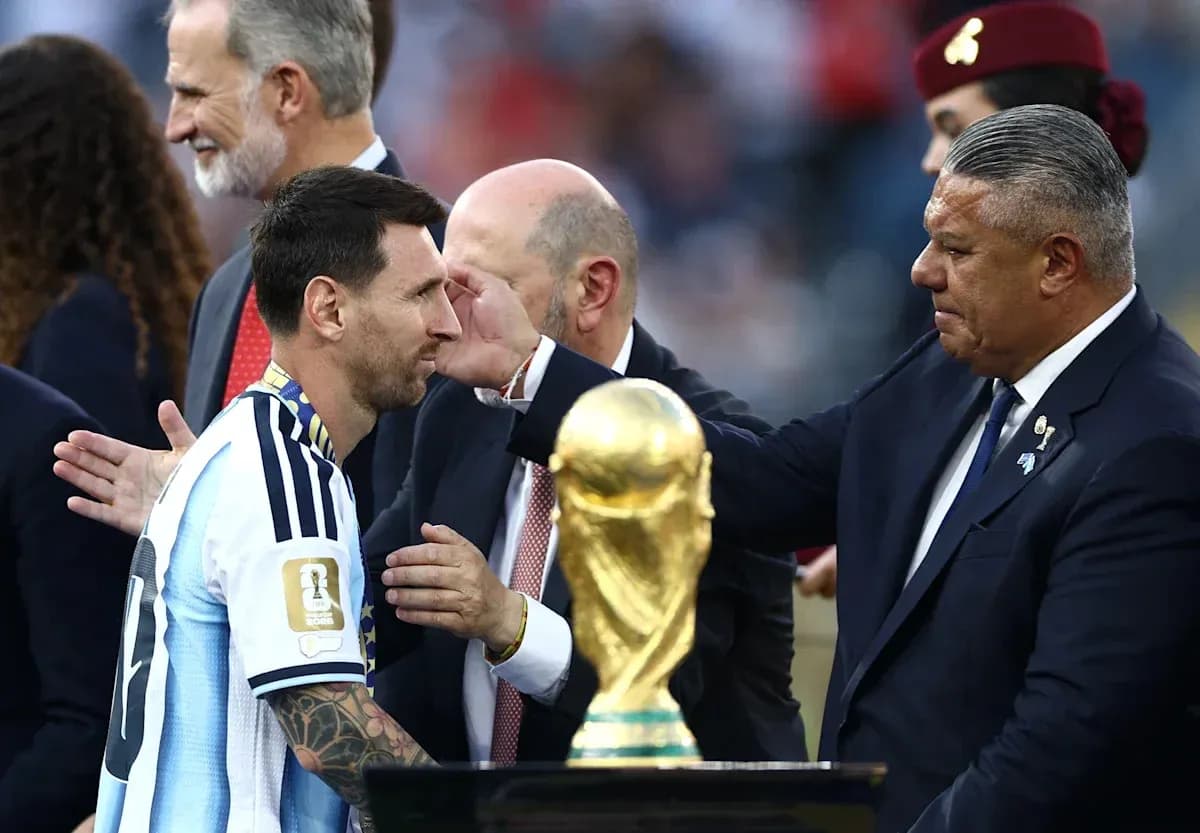 Lionel Messi receiving trophy after winning World Cup Lionel Messi receiving trophy after winning World Cup
