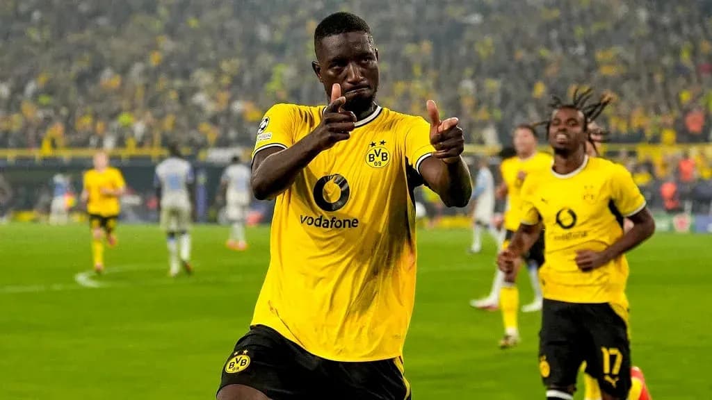Player celebrating after scoring a goal for Borussia Dortmund Player celebrating after scoring a goal for Borussia Dortmund