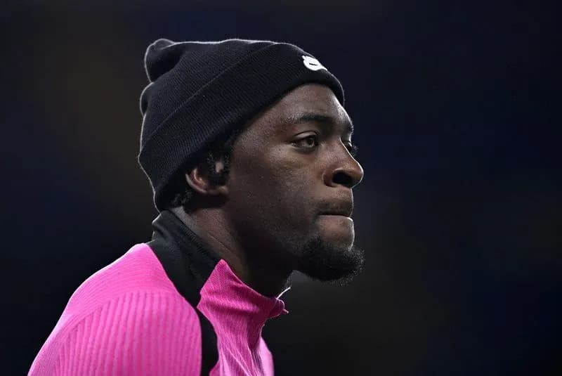 Player in pink warm-up gear during match preparation Player in pink warm-up gear during match preparation