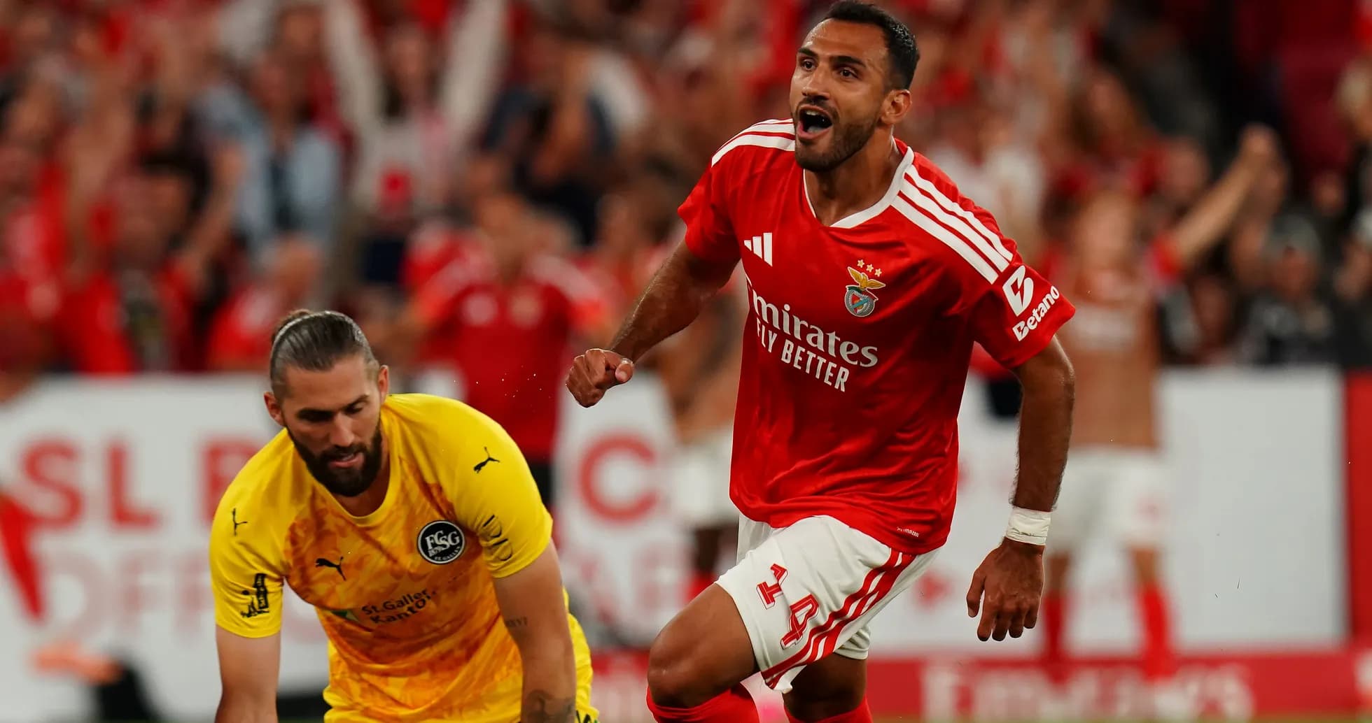 Benfica player celebrating after scoring a goal Benfica player celebrating after scoring a goal