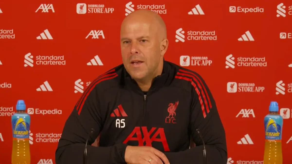 Manager speaking at Liverpool press conference podium Manager speaking at Liverpool press conference podium