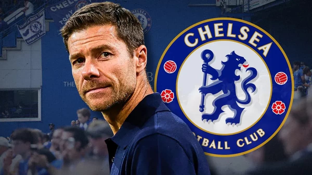 Coach in front of Chelsea FC logo and fans Coach in front of Chelsea FC logo and fans