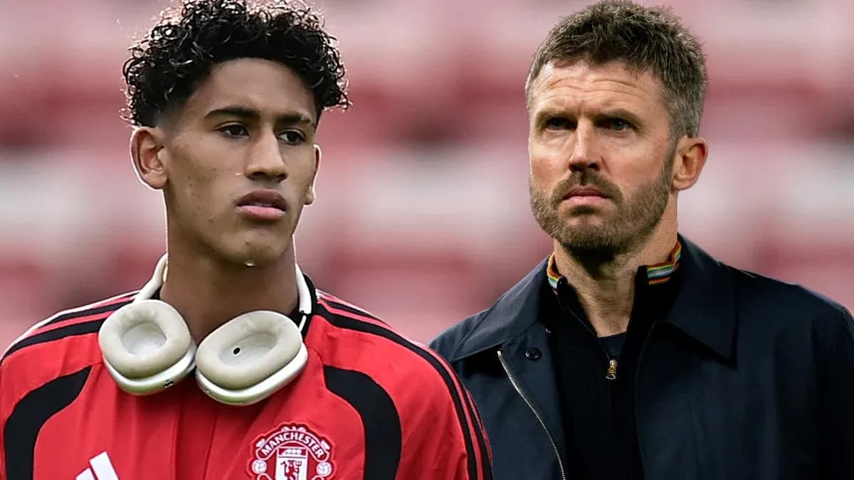 Young player in Manchester United kit with coach Young player in Manchester United kit with coach