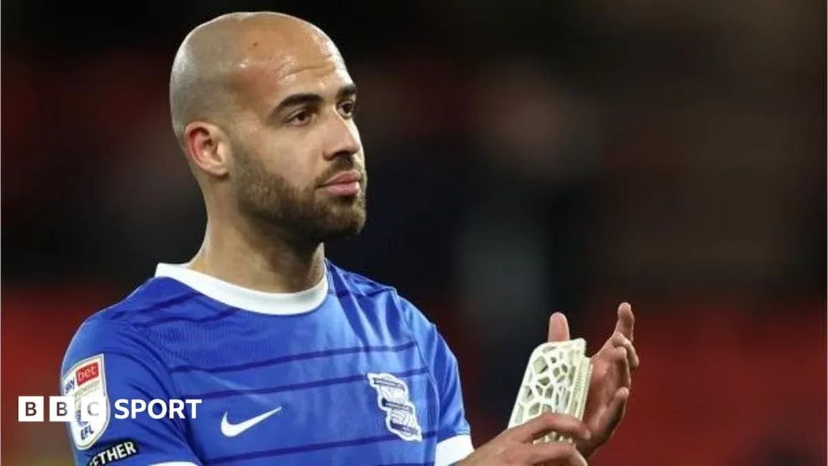 Player in blue jersey applauding after match Player in blue jersey applauding after match