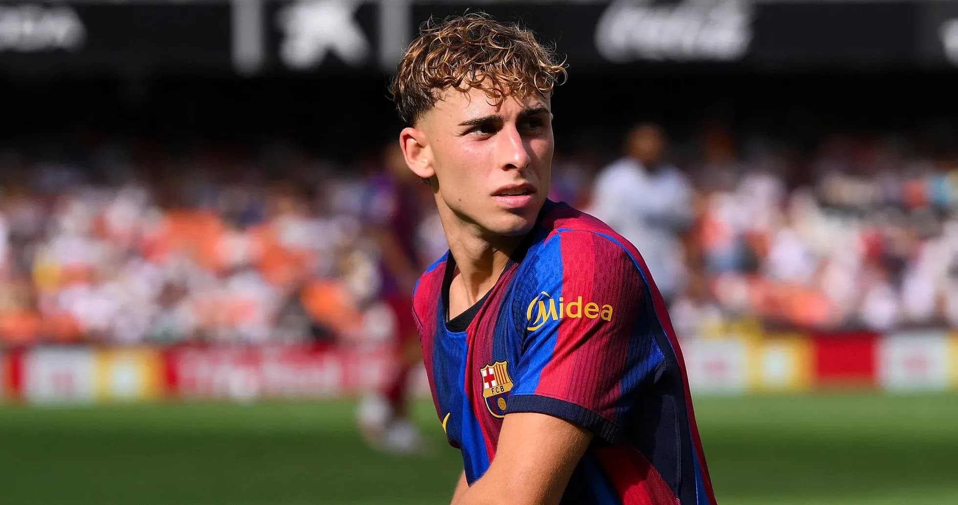 Young player in Barcelona jersey on the field Young player in Barcelona jersey on the field