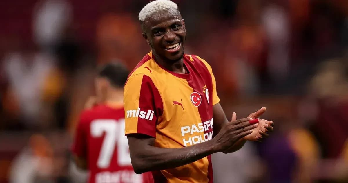 Player celebrating in Galatasaray jersey on field Player celebrating in Galatasaray jersey on field