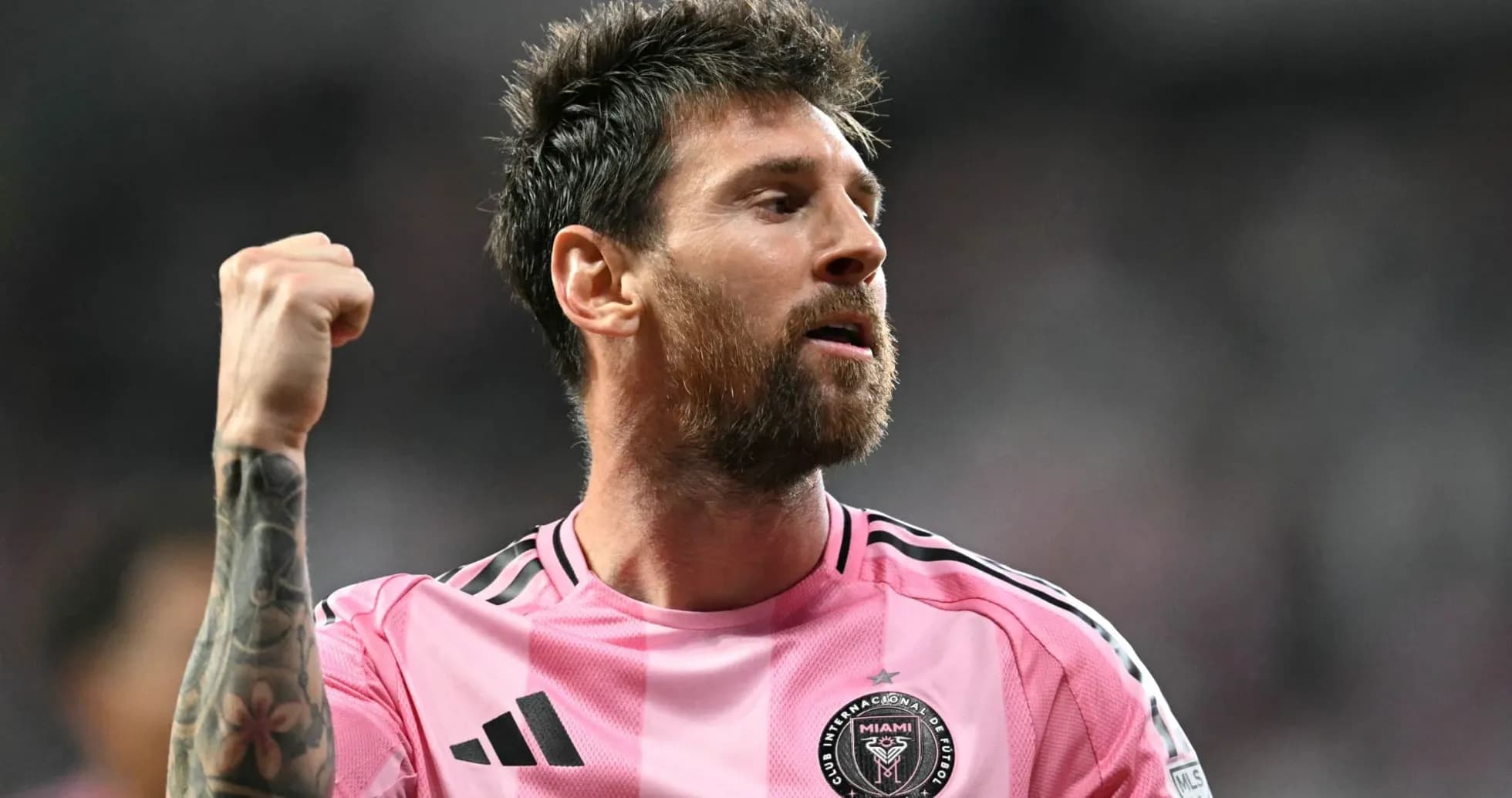 Player celebrating in pink jersey during match Player celebrating in pink jersey during match