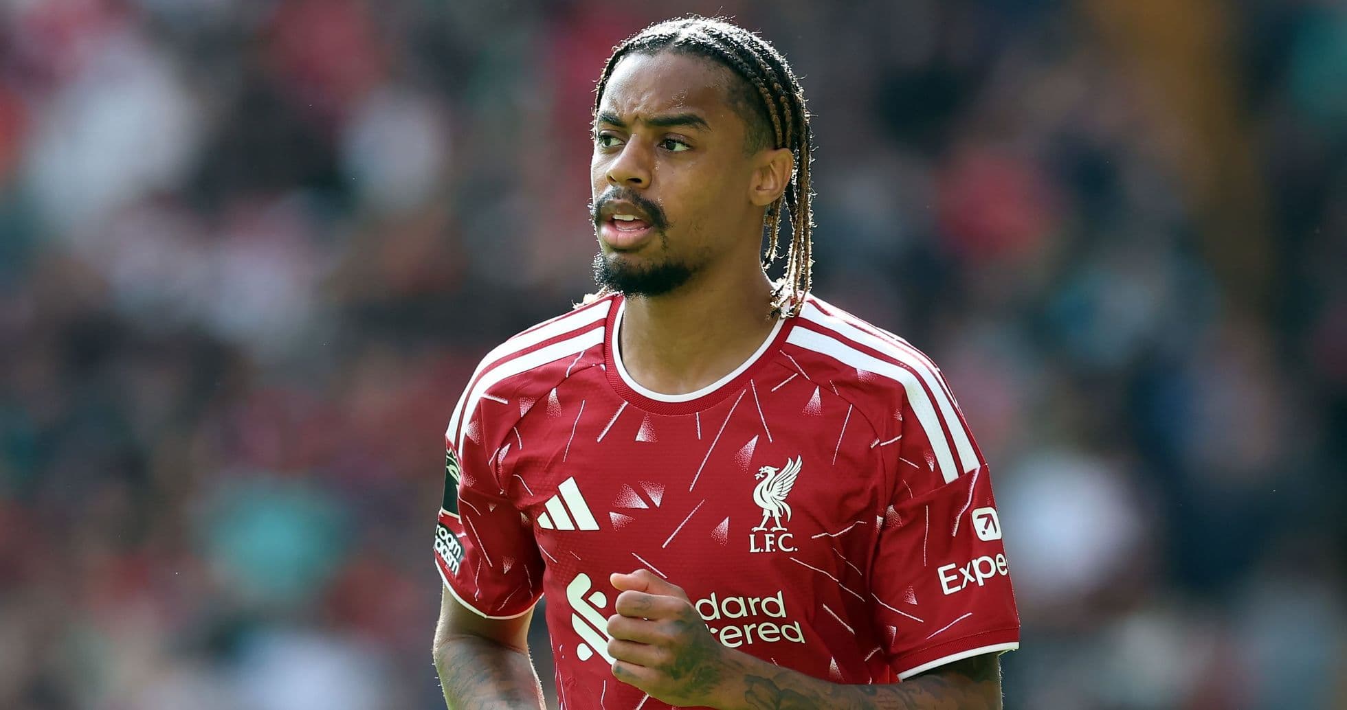 Player in Liverpool FC kit during match action Player in Liverpool FC kit during match action
