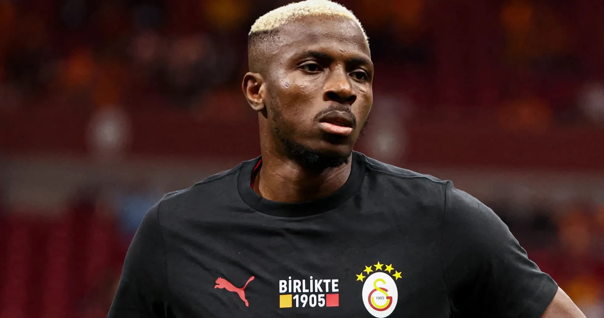 Player in Galatasaray training shirt on the pitch Player in Galatasaray training shirt on the pitch