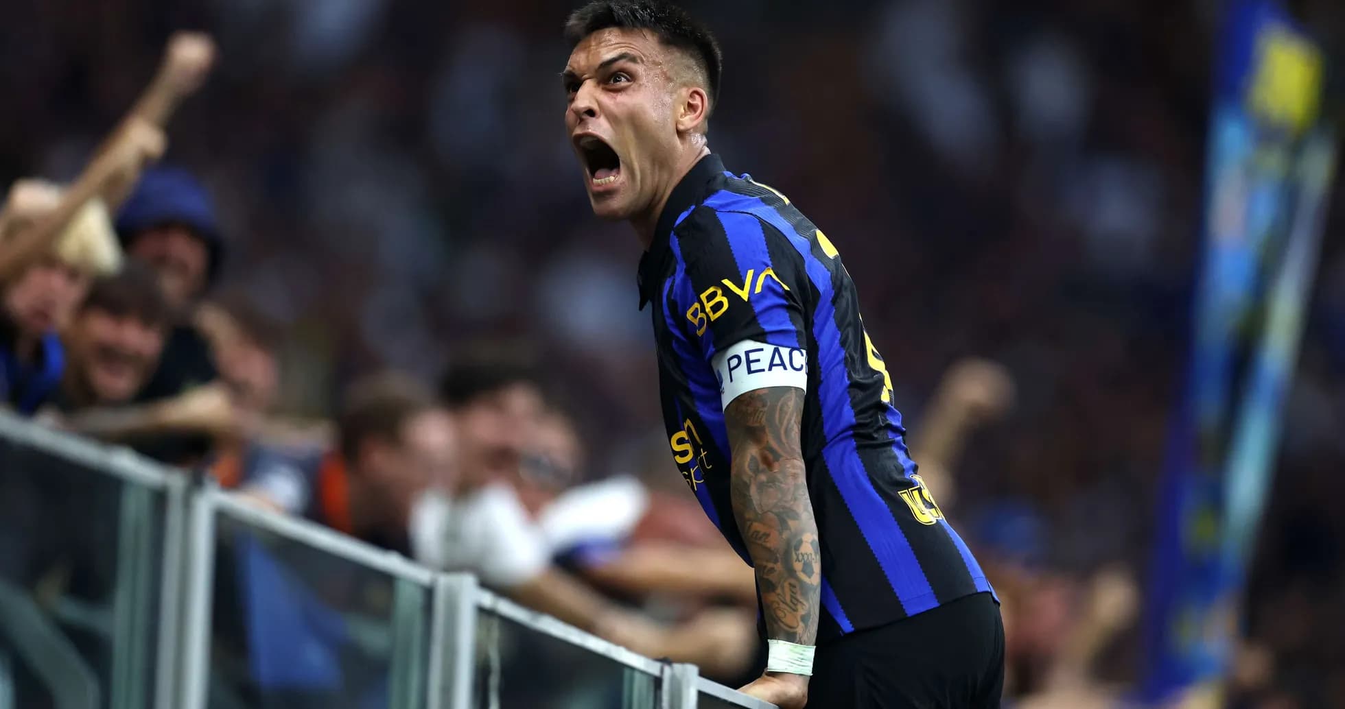 Lautaro Martinez celebrating with fans after a goal Lautaro Martinez celebrating with fans after a goal