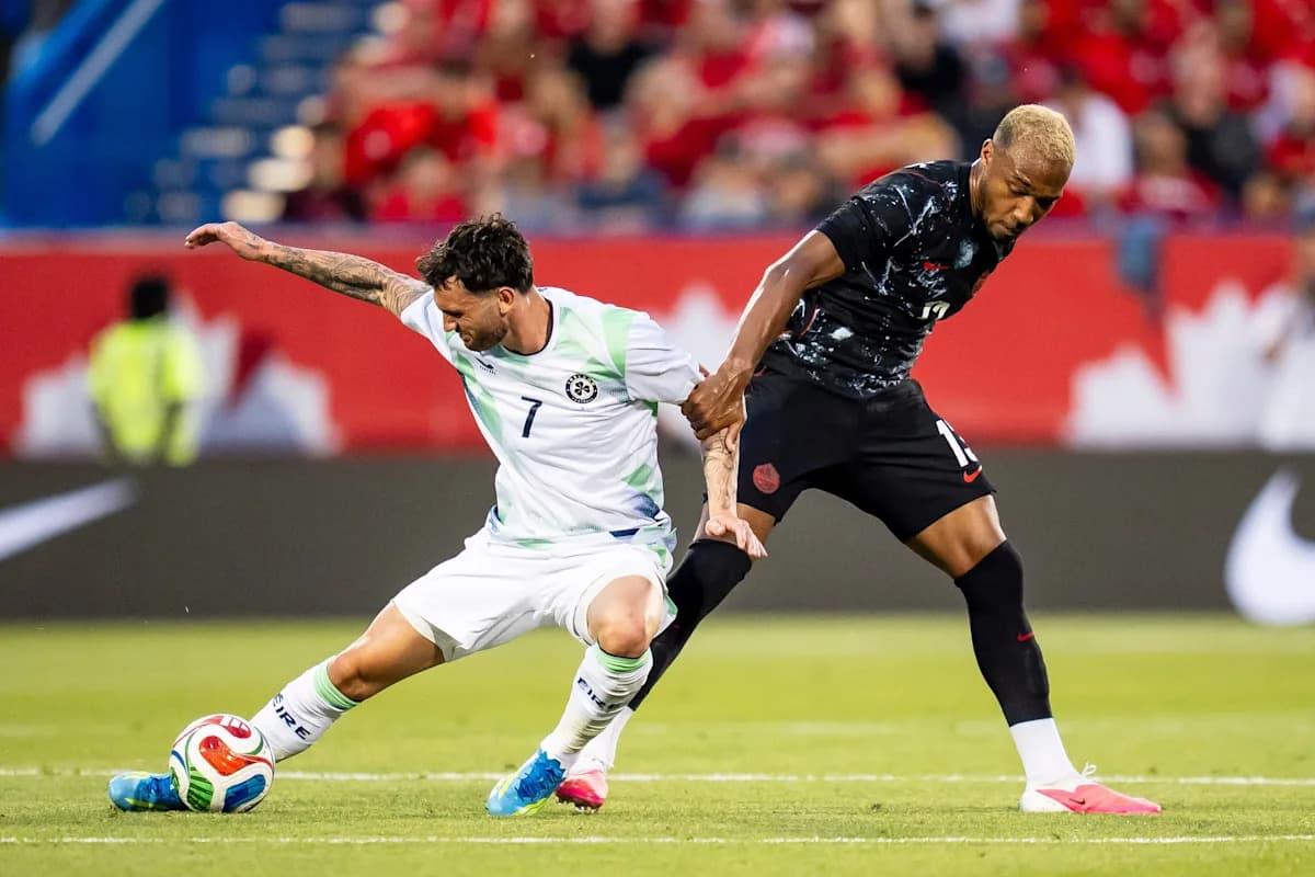 Two players battling for the ball during soccer match Two players battling for the ball during soccer match