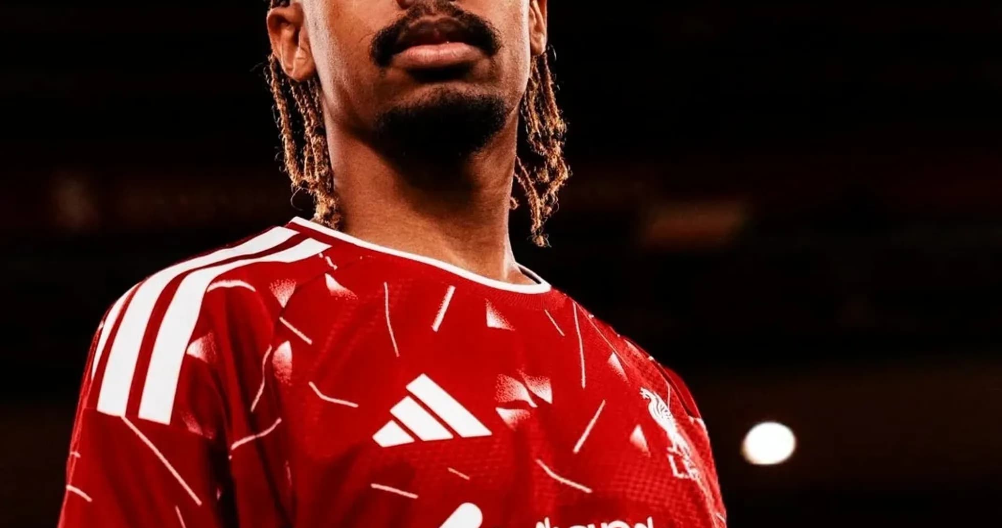 Player in red jersey posing confidently for photo Player in red jersey posing confidently for photo