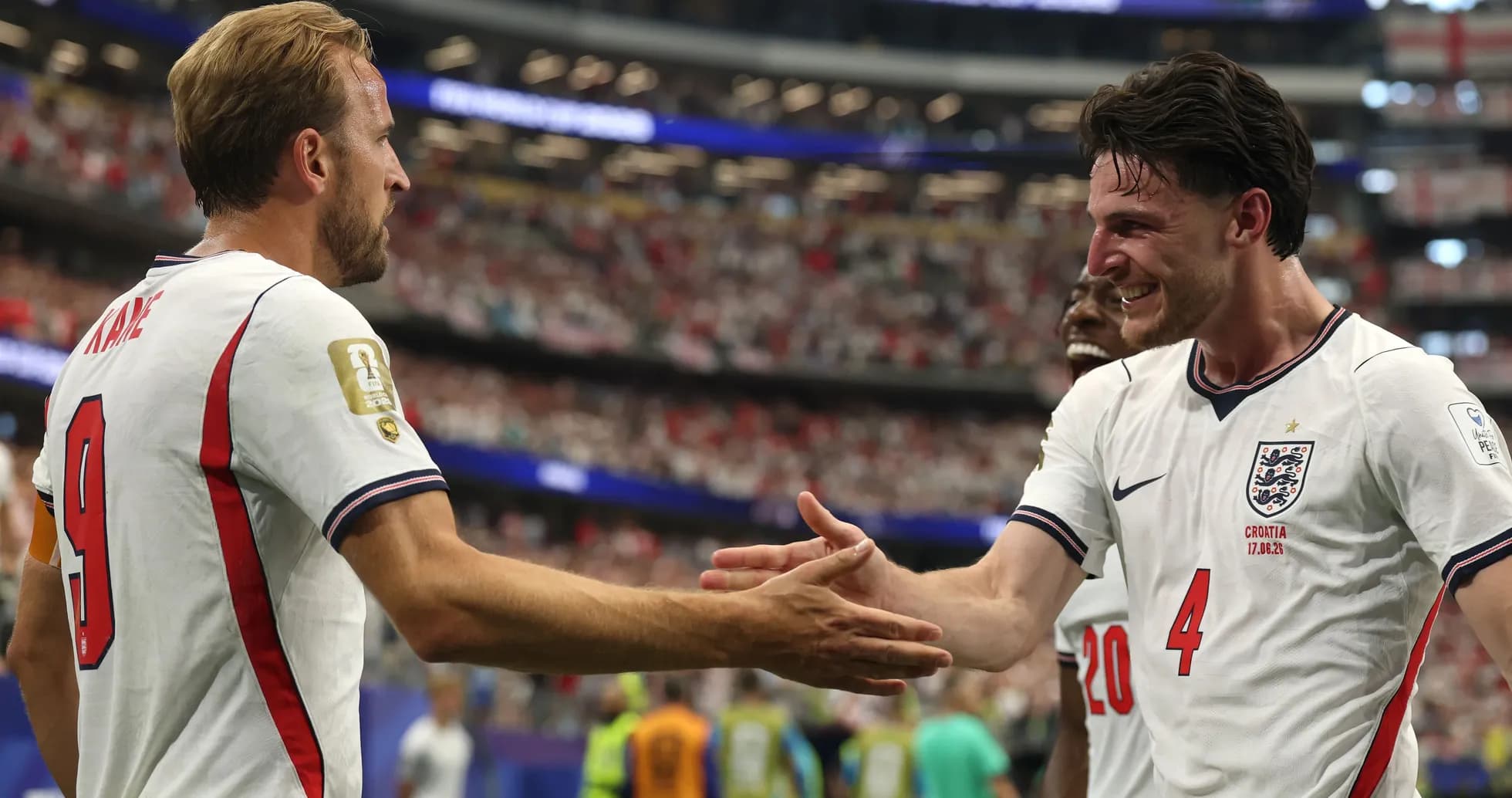 Harry Kane and Declan Rice celebrating on the pitch Harry Kane and Declan Rice celebrating on the pitch