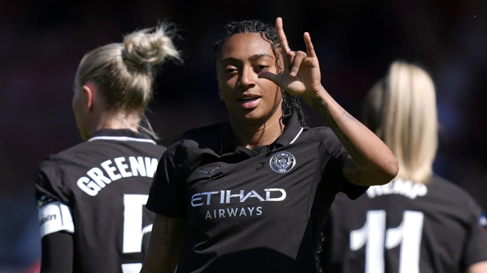 Player celebrating with teammates during match Player celebrating with teammates during match