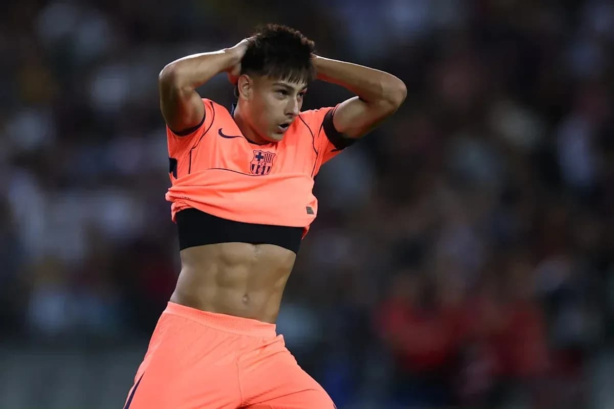 Player adjusting shirt during a match Player adjusting shirt during a match