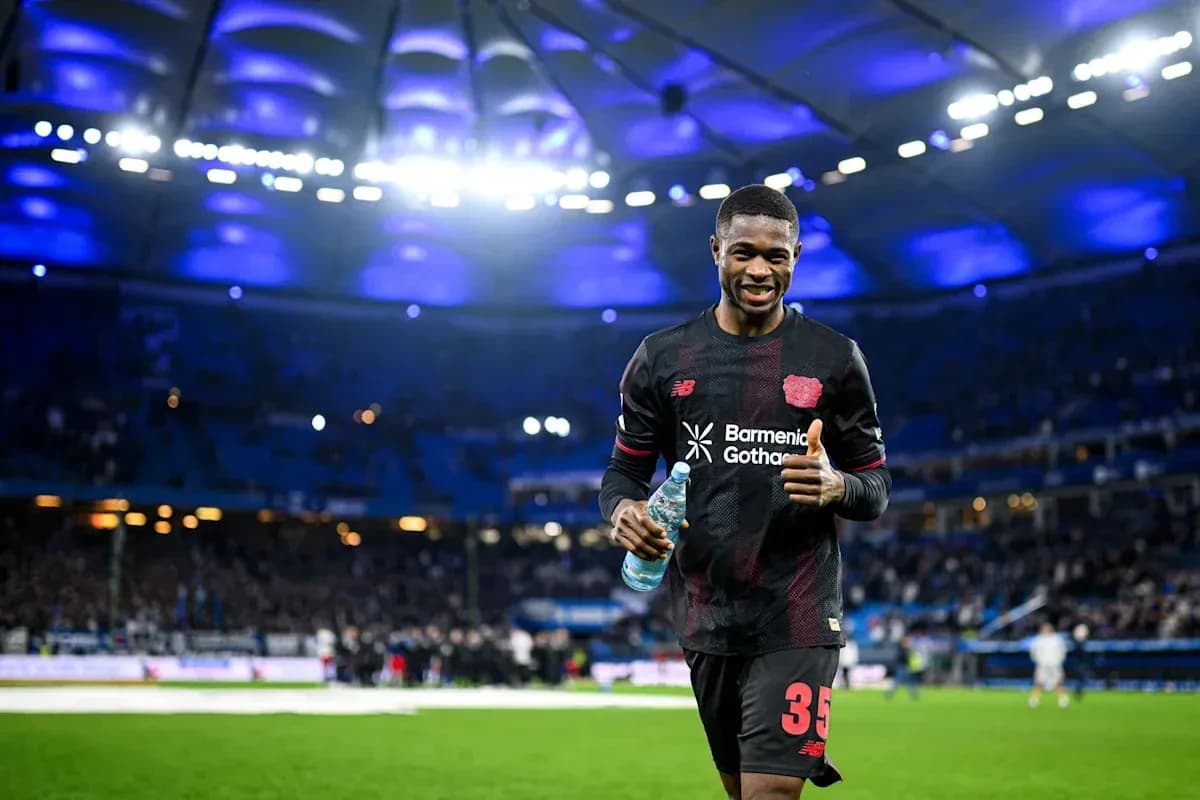 Player celebrating with water bottle on pitch Player celebrating with water bottle on pitch