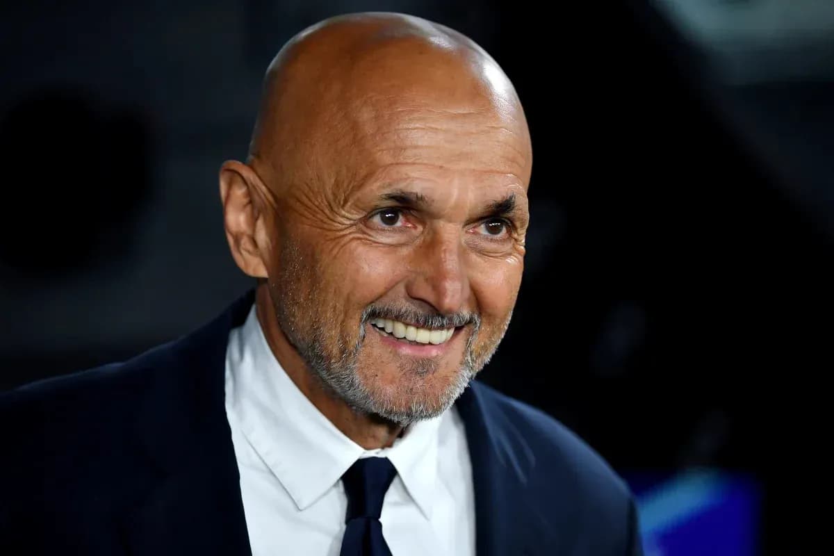 Man smiling in a suit at an event Man smiling in a suit at an event