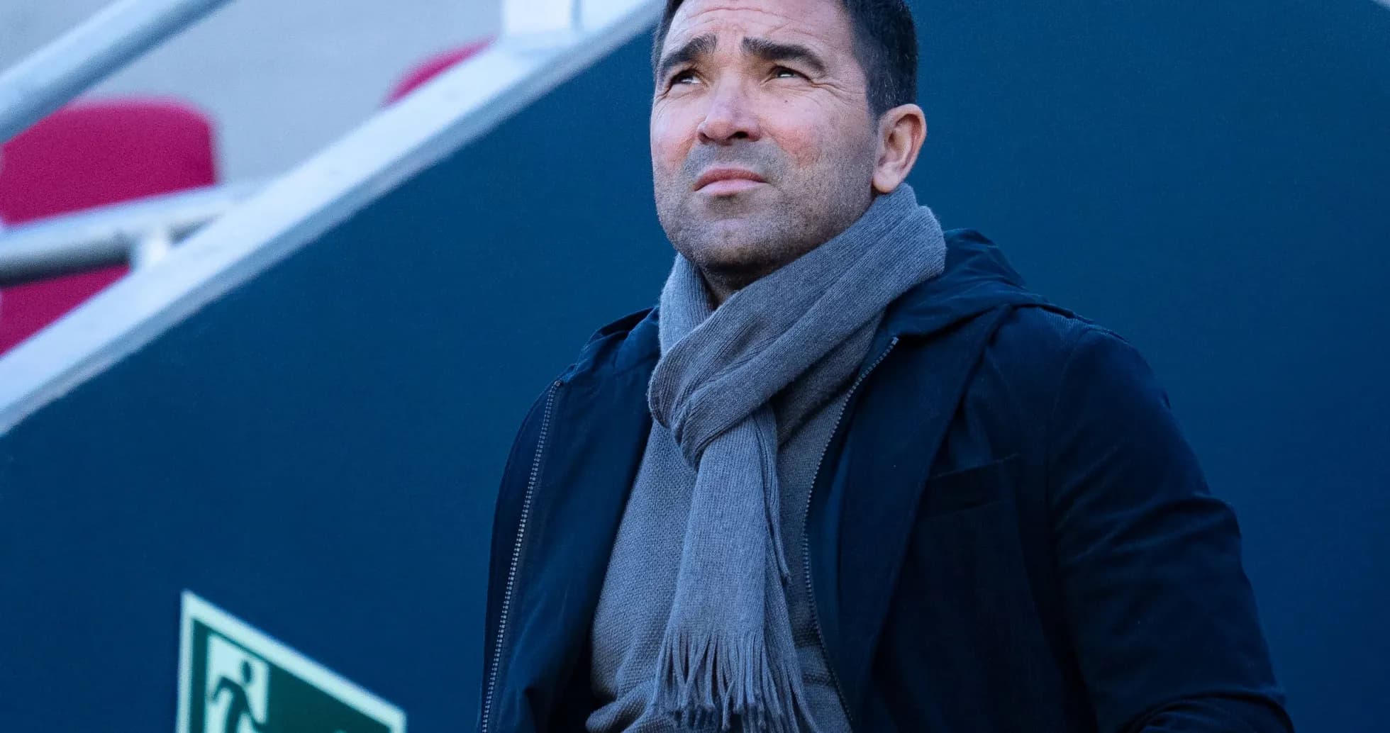 Man in coat and scarf looking upwards Man in coat and scarf looking upwards