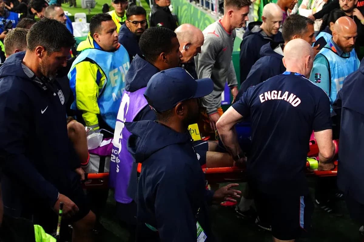Medical staff attending to player on stretcher Medical staff attending to player on stretcher