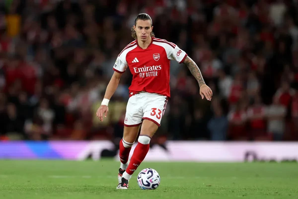 Arsenal player dribbling ball during match Arsenal player dribbling ball during match