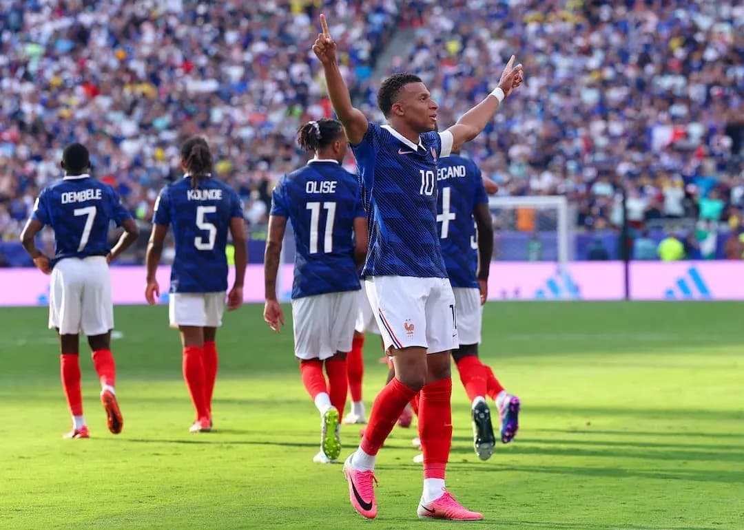 Kylian Mbappé celebrating a goal for France Kylian Mbappé celebrating a goal for France