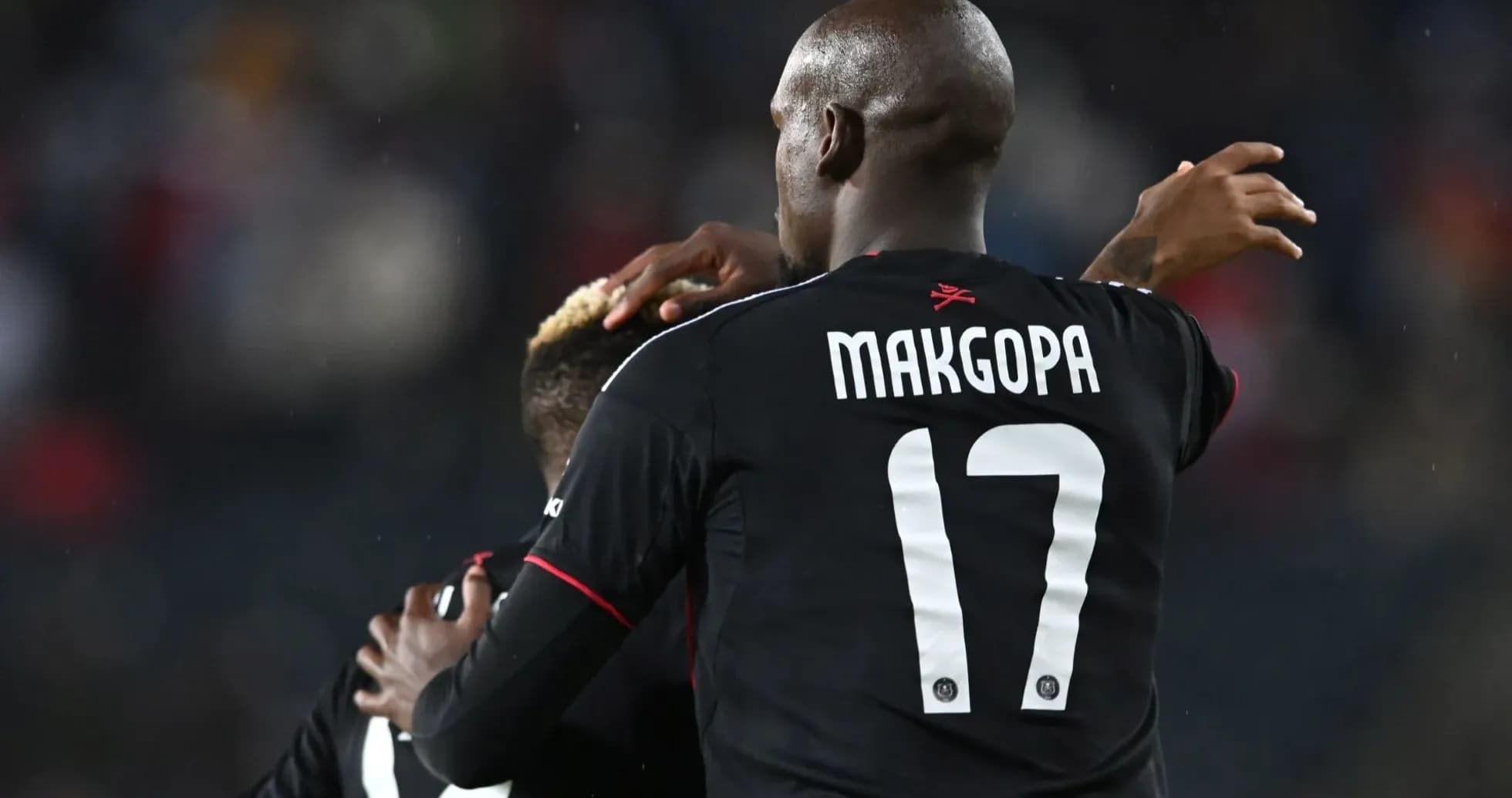Player celebrating with teammate after scoring goal Player celebrating with teammate after scoring goal