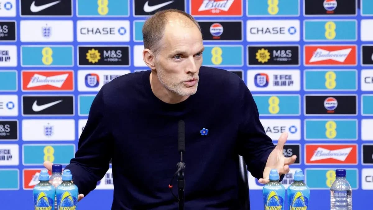 Manager speaking at press conference with backdrop Manager speaking at press conference with backdrop