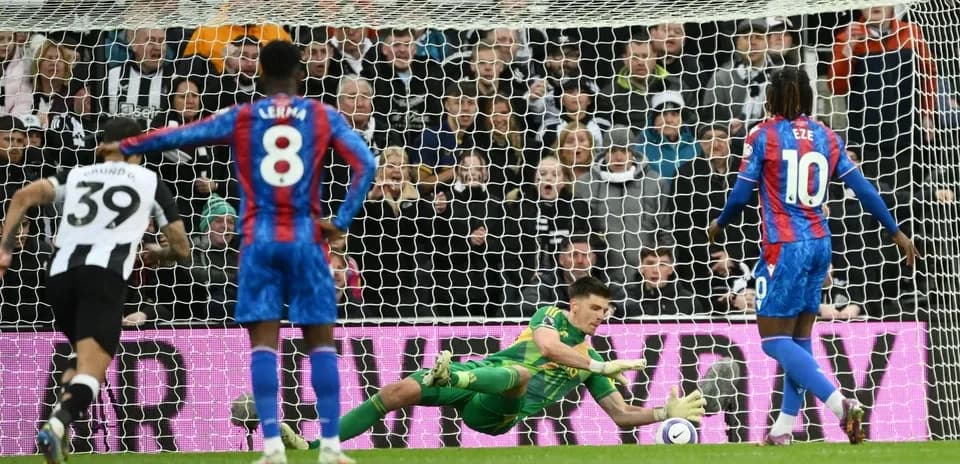 Goalkeeper saving a penalty in football match Goalkeeper saving a penalty in football match