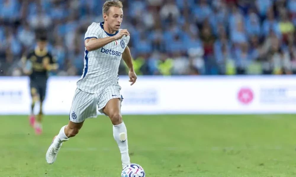 Player sprinting with ball during a match Player sprinting with ball during a match