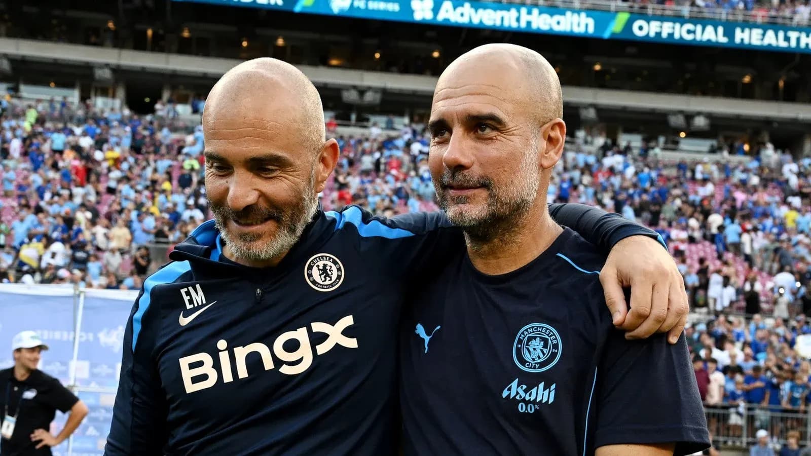 Two football coaches embracing on the field Two football coaches embracing on the field
