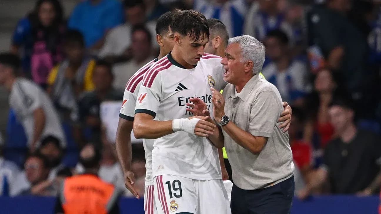 Coach speaking to player during match on sideline Coach speaking to player during match on sideline