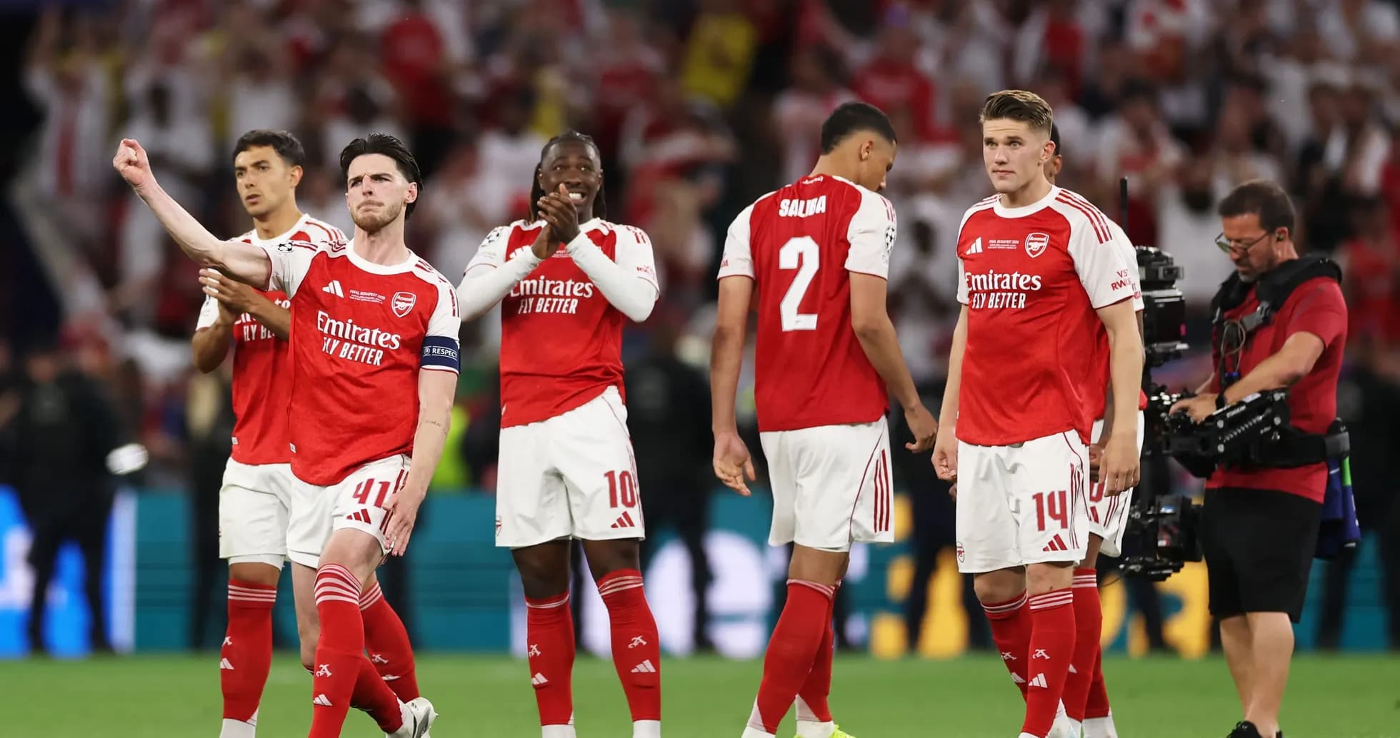Arsenal players celebrating after a match victory Arsenal players celebrating after a match victory