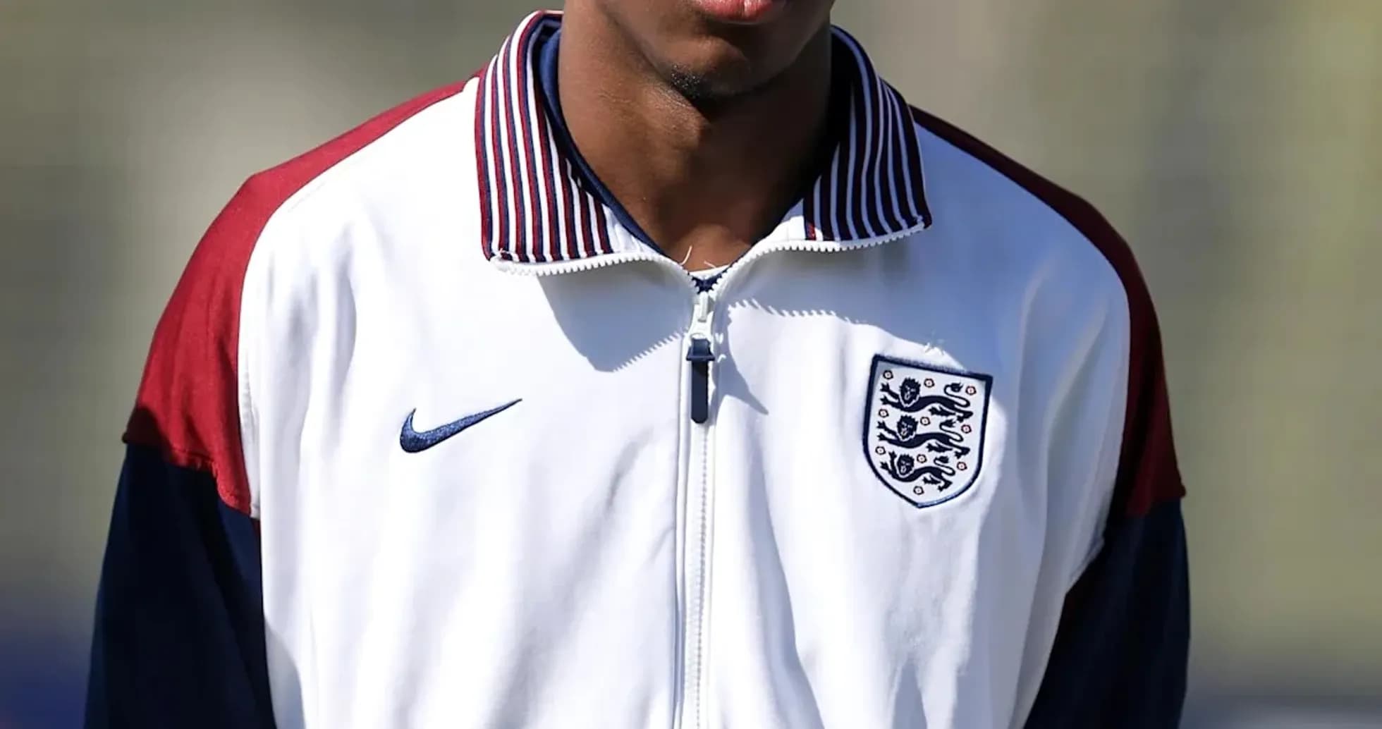 Player wearing England training jacket on field Player wearing England training jacket on field