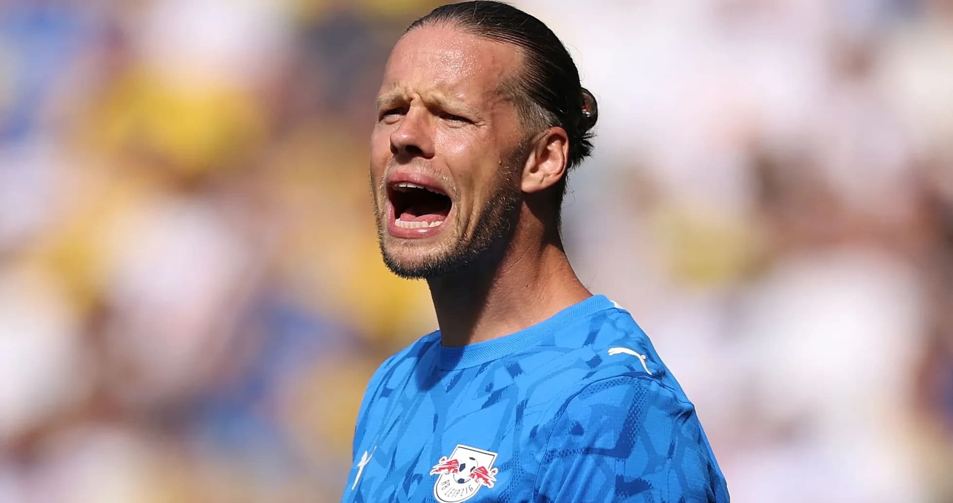 Goalkeeper shouting during a match on the field Goalkeeper shouting during a match on the field
