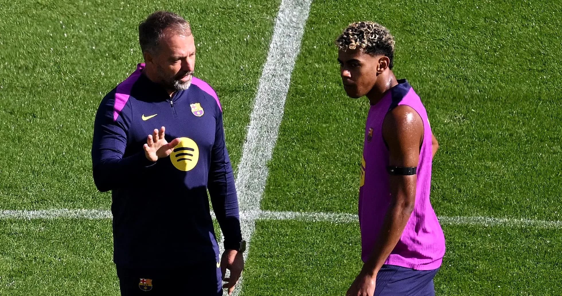 Coach discussing with player during training session Coach discussing with player during training session