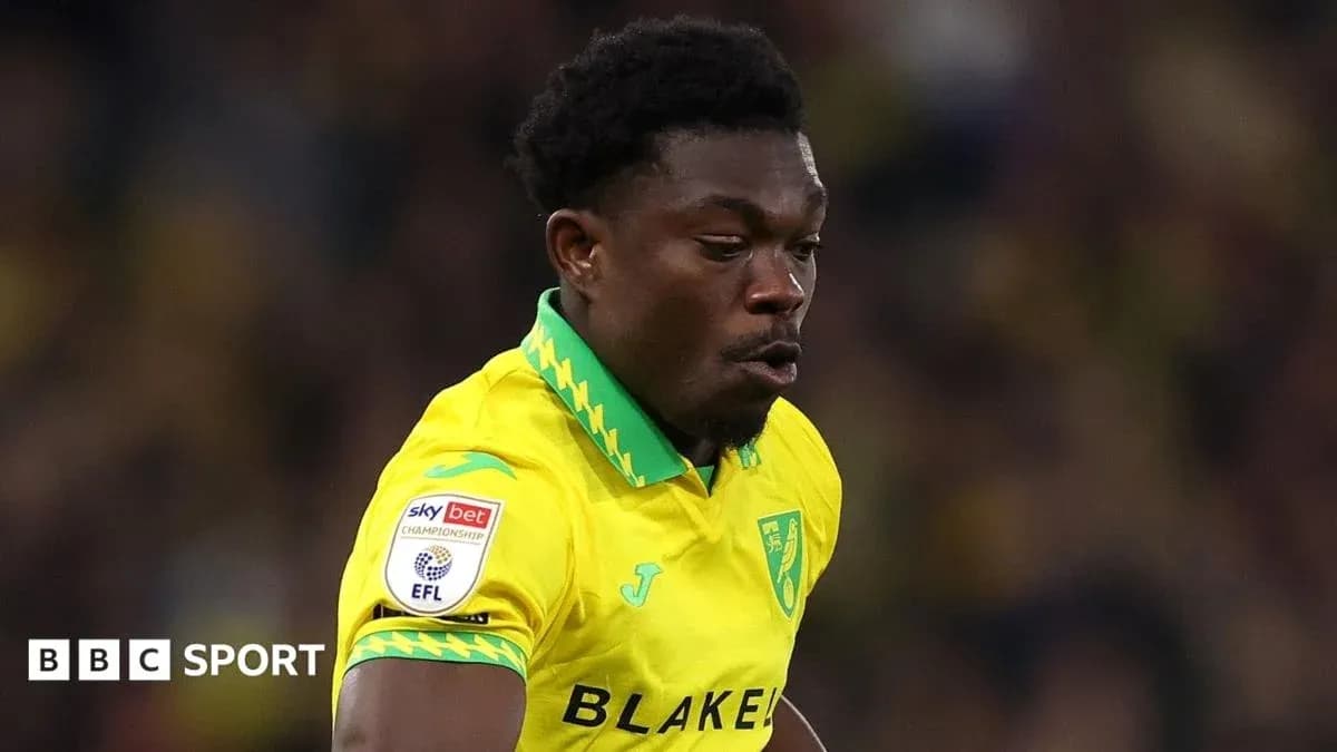Player in yellow kit running on the field Player in yellow kit running on the field