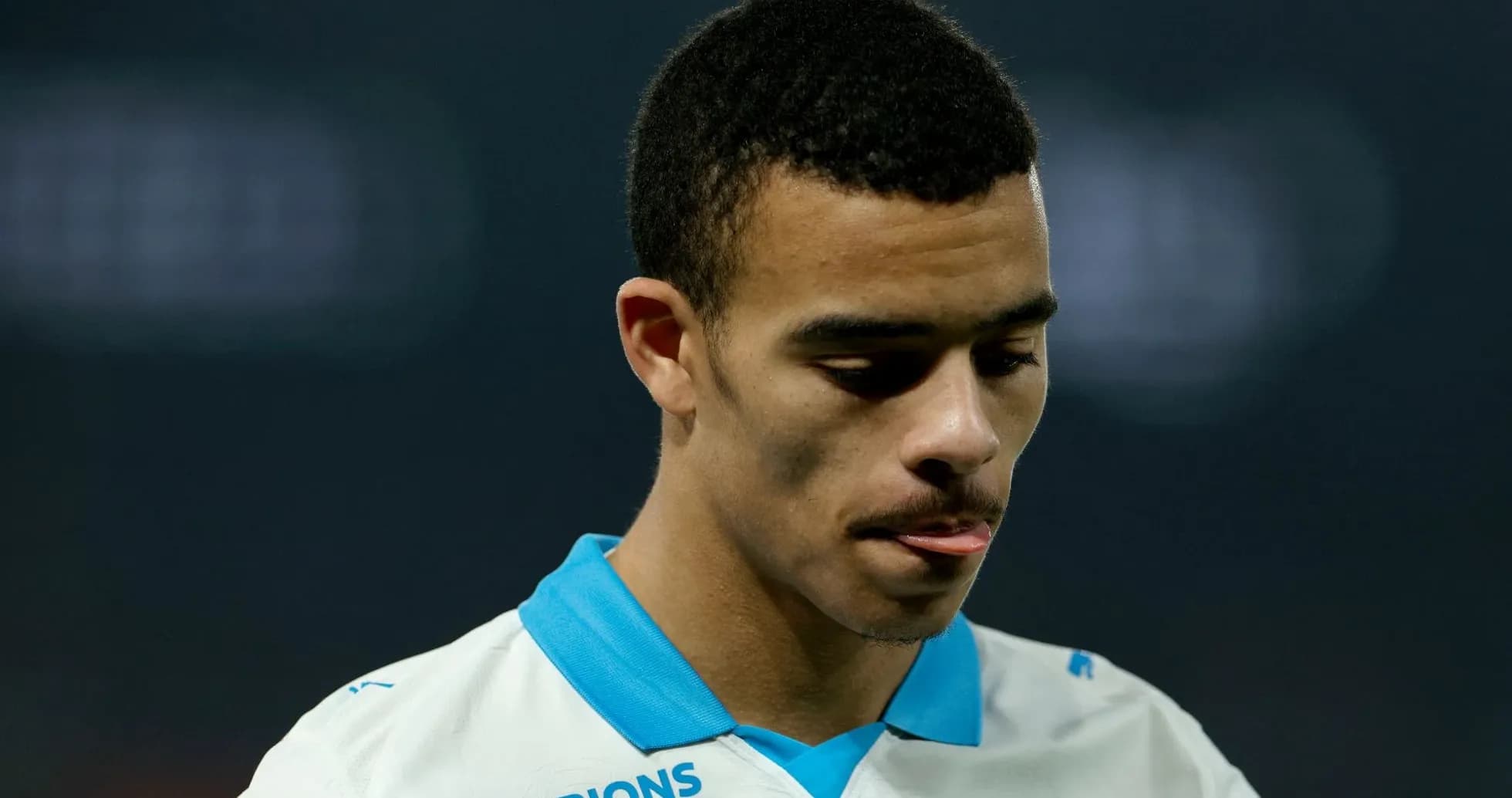 Player looking down during match in white jersey Player looking down during match in white jersey