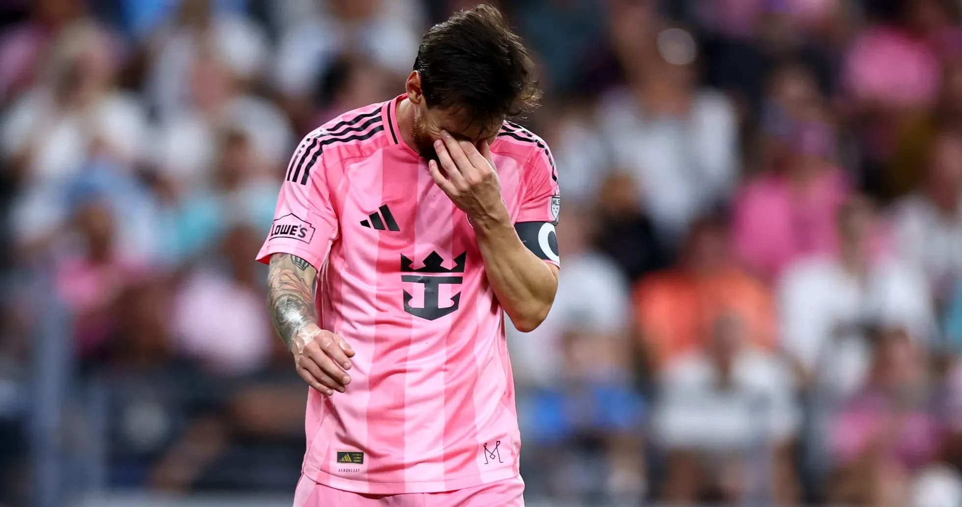 Player in pink jersey walking with head down Player in pink jersey walking with head down