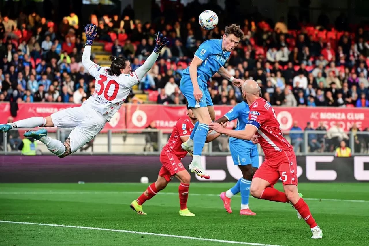 Monza goalkeeper attempting to save a header Monza goalkeeper attempting to save a header