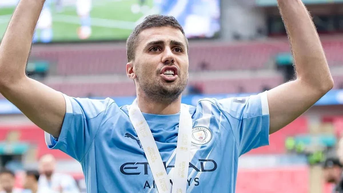 Player celebrating with medal after match victory Player celebrating with medal after match victory