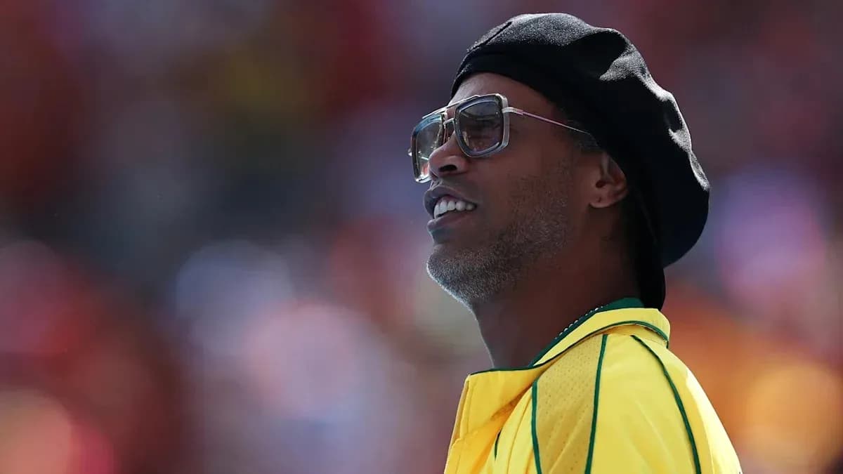 Former player wearing sunglasses and yellow jersey Former player wearing sunglasses and yellow jersey
