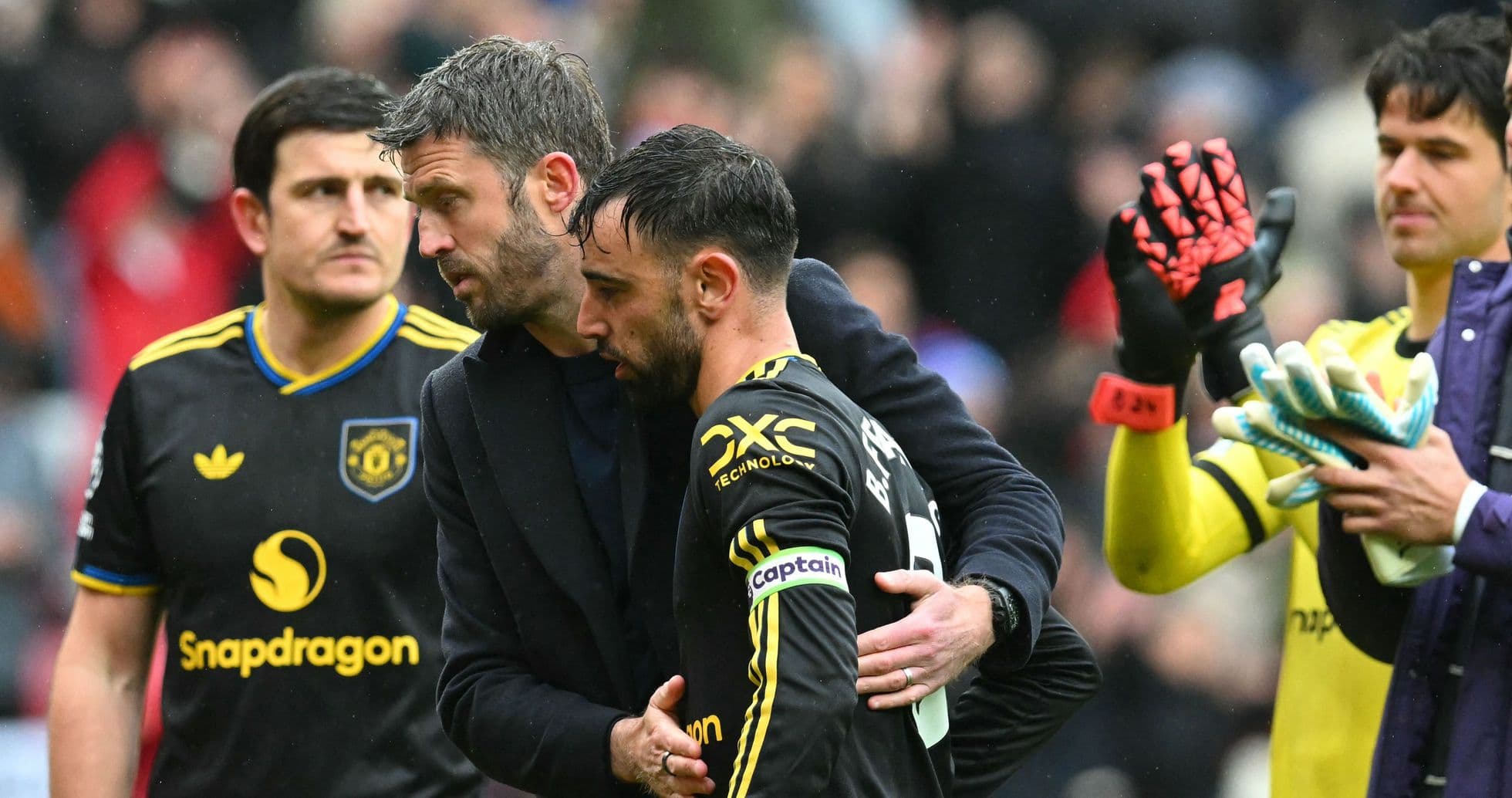 Bruno Fernandes receiving support from coach after match Bruno Fernandes receiving support from coach after match