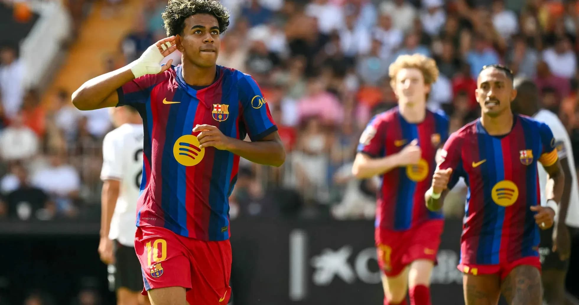 Barcelona players celebrating a goal against Valencia Barcelona players celebrating a goal against Valencia